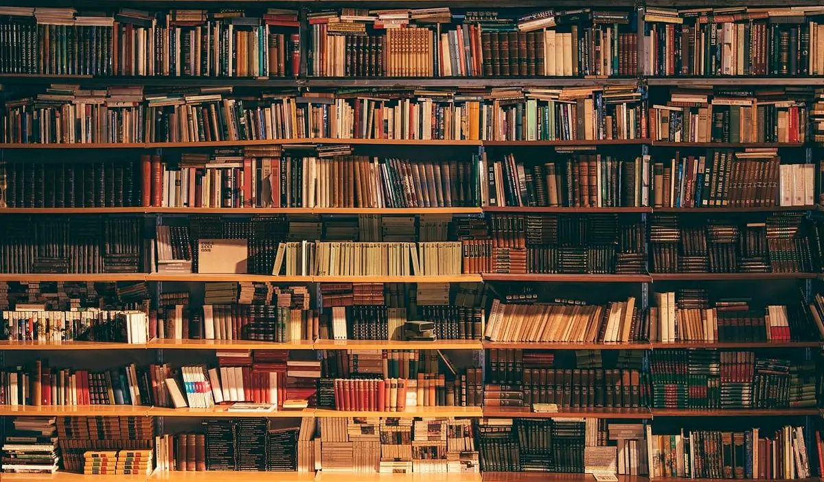 Stack of books on a wooden table